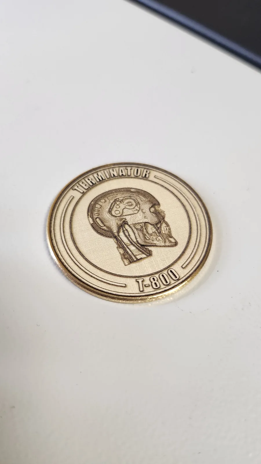 Engraved brass coin